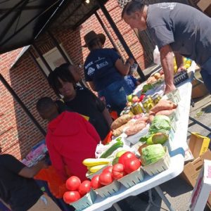 Kids shopping at farmers market.