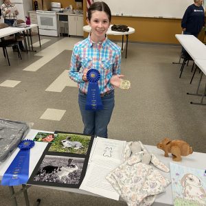 Elizabeth Knight with ribbons at Fur & Feathers Show