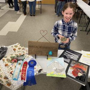 Alaina Knight with ribbons at Fur & Feathers Show