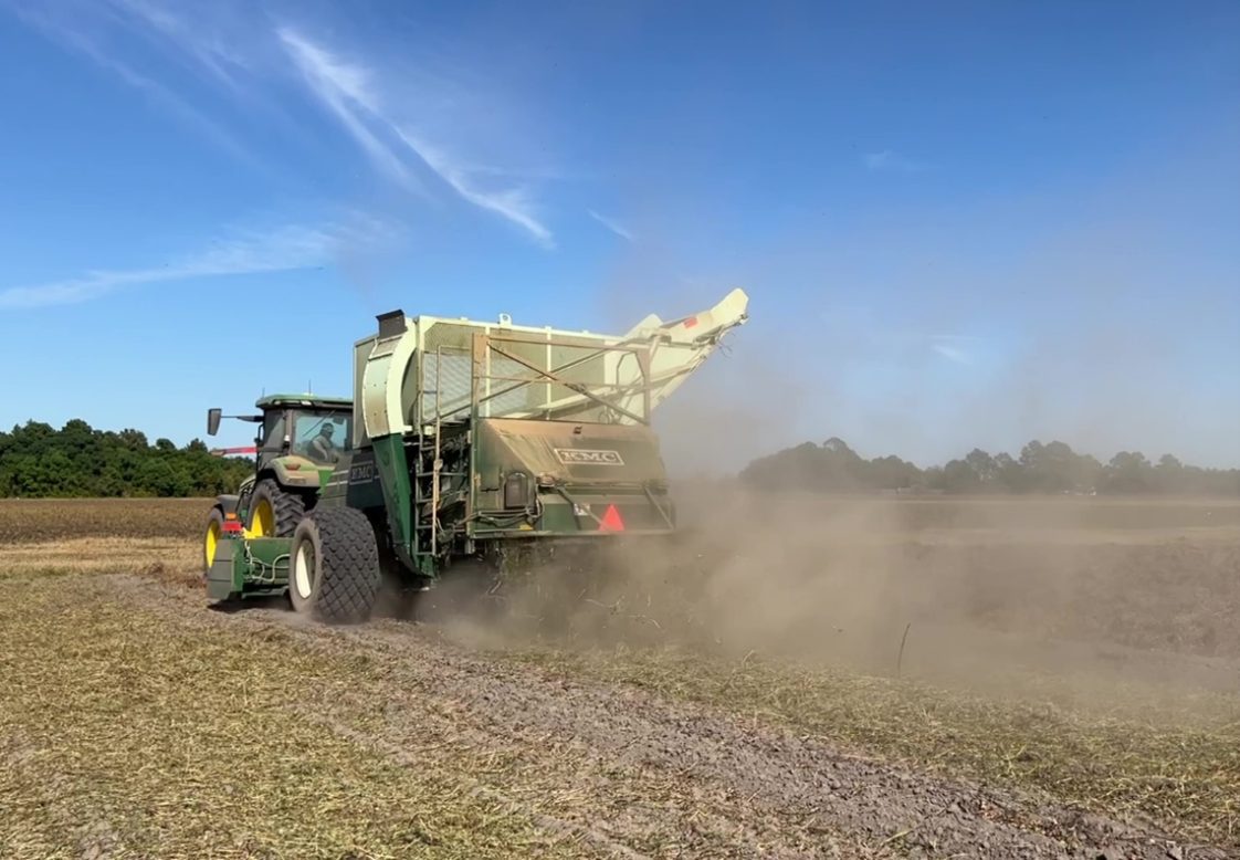 A peanut combine in a field.