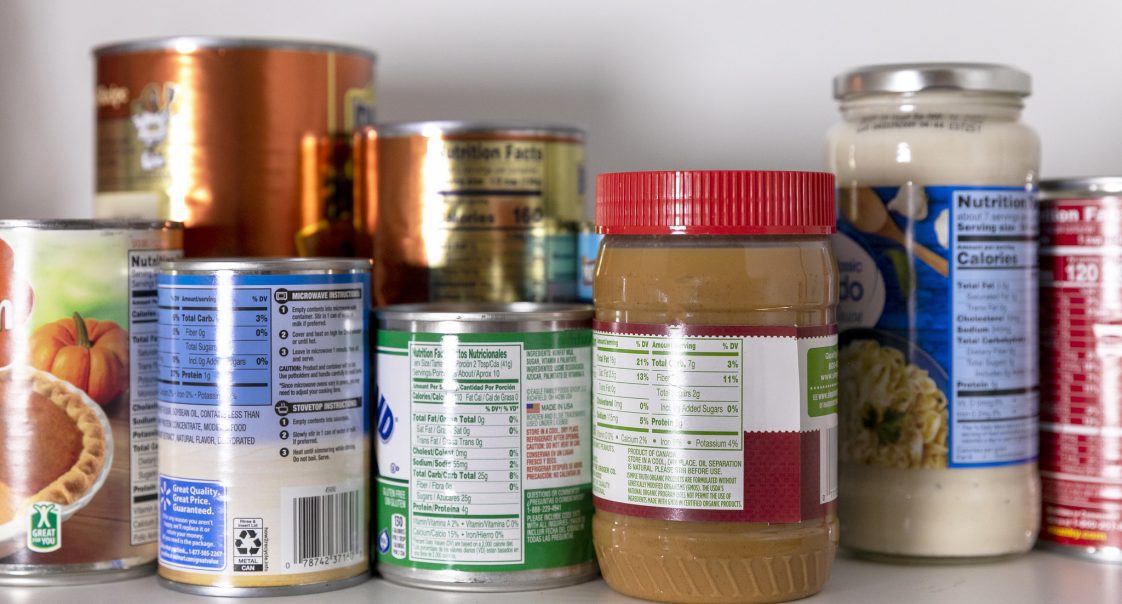 Canned food sitting on a shelf