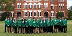 A group photo of the 2025-2026 Alabama 4-H state ambassadors in front of Samford Hall on the campus of Auburn University.