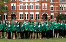 A group photo of the 2025-2026 Alabama 4-H state ambassadors in front of Samford Hall on the campus of Auburn University.