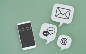 A green background with an illustrated phone and email, text, and the @ symbol icons.