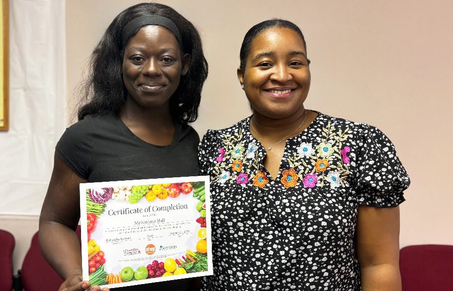 An EFNEP educator and participant posing for a picture.