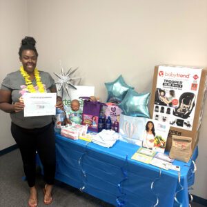 A Today's Mom participant holding a certificate.