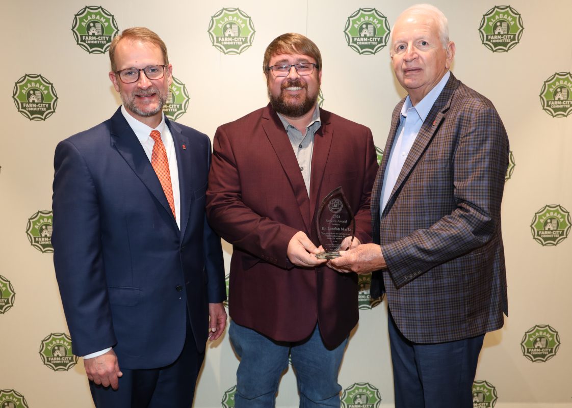 Alabama Farm-City Service Award presented to Landon Marks. From left are Alabama Farm-City Committee Chair Jeff Helms, Marks and Alabama Farmers Agriculture Foundation board member Mahlon Richburg.