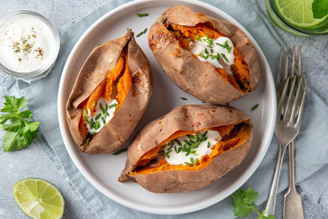 baked sweet potato with yogurt sause. Top view.