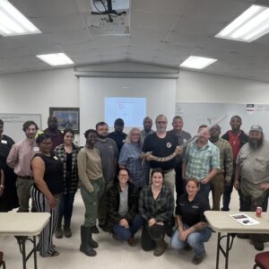 A group of people who attended a snake identification and safety training.