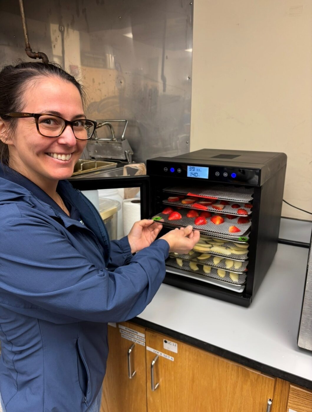 Figure 4. Rebecca Catalina demonstrates approved food dehydration techniques under Alabama’s Cottage Food Law, provided the product meets water activity requirements.