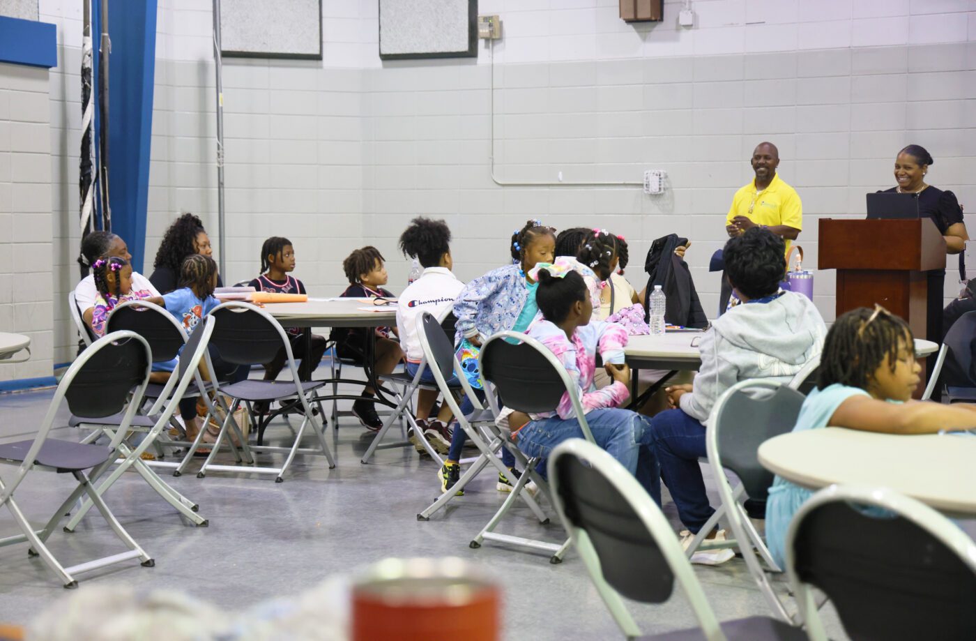 Alabama Extension agents and participants at a Parent‑Child Financial Literacy in Progress Program event.