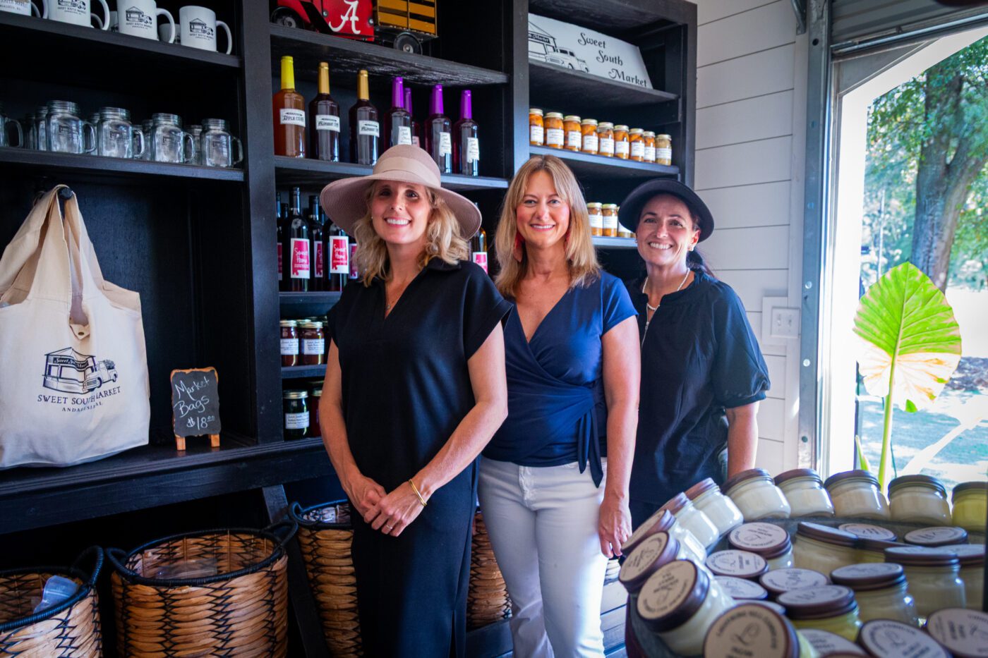 Extension Food Safety and Quality Agent Bridgette Brannon posing with the owners of the Sweet South Market