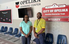 Regina Meadows and Tamarcus Milner posing for a picture at Opelika Learning Center.