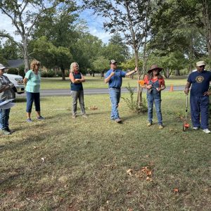 Home Horticulture Extension Agent Jacob Turner, third from right, lead the group in building the new sensory garden.