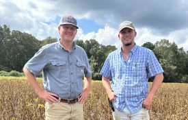 Extension's Cade Grace with Walker County farmer Payton Key.