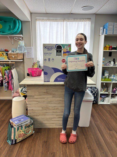 Expectant mother Kailey Smith celebrates completing the Today's Mom program.