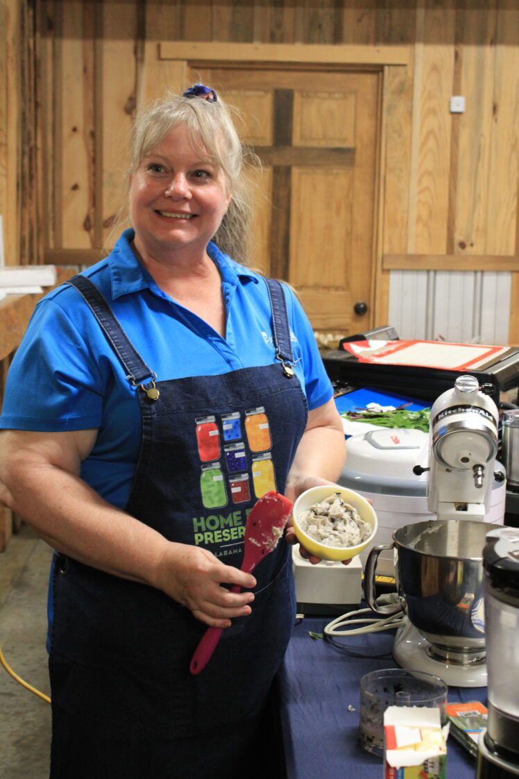 Extension Agent Christy Mendoza making herb butter.