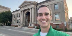 Casey Mull standing outside the A.B. Graham Memorial Center & Museum in Conover, Ohio, which is known as the birthplace of 4-H.