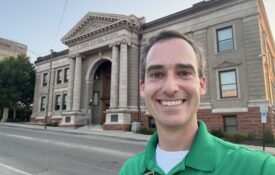 Casey Mull standing outside the A.B. Graham Memorial Center & Museum in Conover, Ohio, which is known as the birthplace of 4-H.