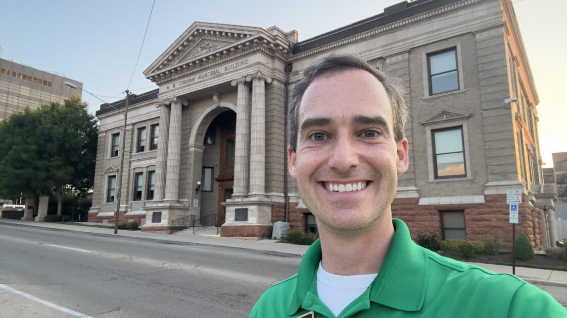 Casey Mull standing outside the A.B. Graham Memorial Center & Museum in Conover, Ohio, which is known as the birthplace of 4-H.