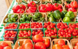 Peppers and tomatoes at a farmers market.