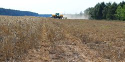 A planter driving through a field.