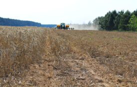 A planter driving through a field.