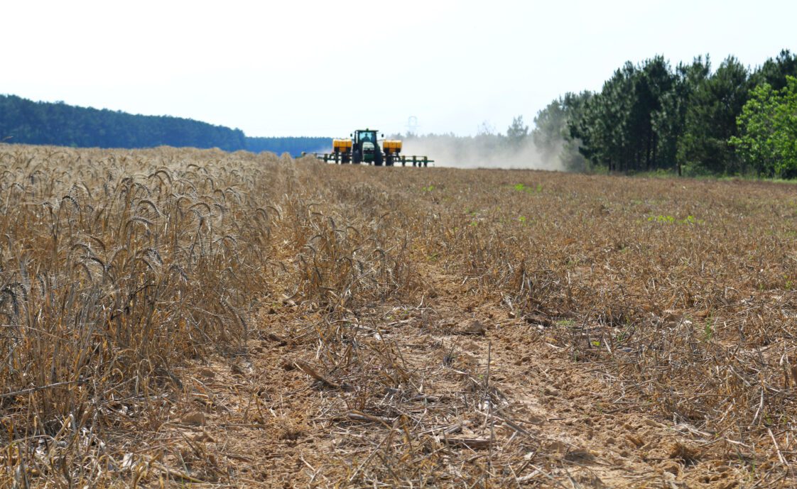 A planter driving through a field.