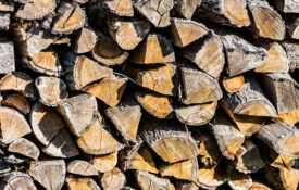 Stacked firewood logs textured background
