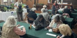 A home horticulture agent leading a class on gardening.