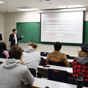 Michael Lopez of Texas A&M presents to students at Auburn University.