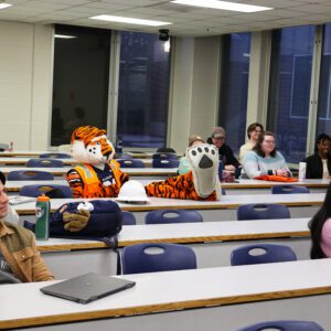 Auburn's official mascot, Aubie, makes a surprise visit to a class at Auburn University.