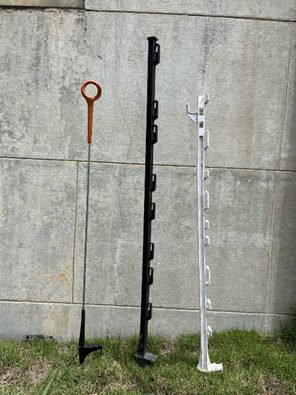Three examples of temporary fencing posts: one white plastic, one black plastic, and one metal with a circular top.