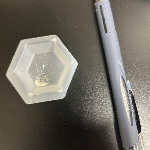 Figure 9. Only a small amount of alum at a rate equivalent to 50 pounds per acre-foot is needed to treat the sample used in the previous photo series.