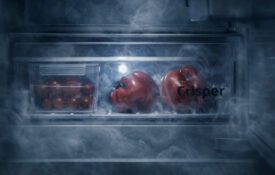 Vegetables in a crisper drawer with a smoky effect over them to resemble a graveyard.