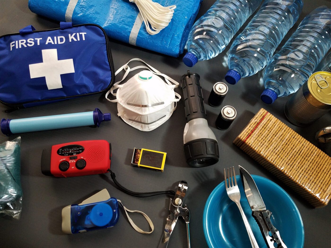 Various items that make up an emergency kit.