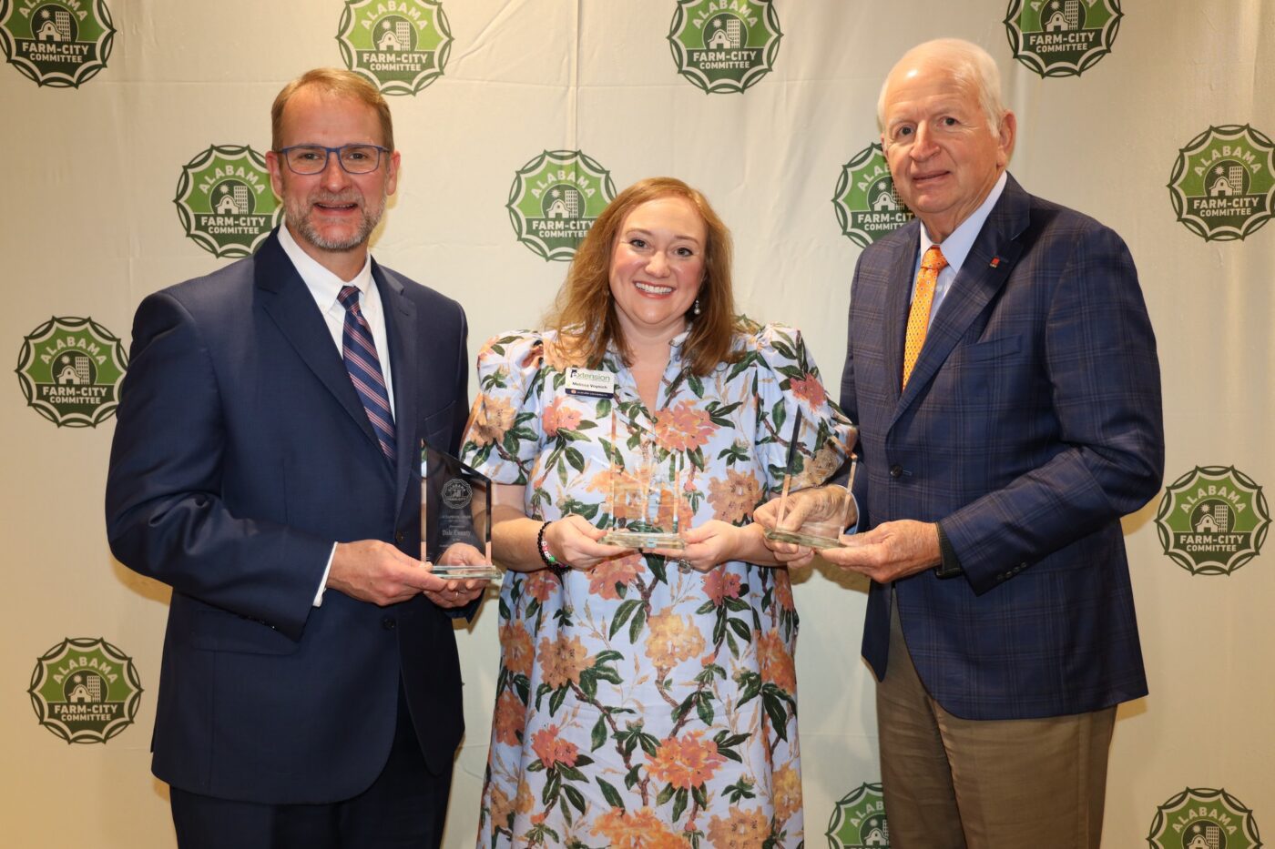From left are Alabama Farm-City Committee Chair Jeff Helms, Dale County Farm-City Committee Co-Chair Melissa Voynich and AFAF board member Mahlon Richburg.