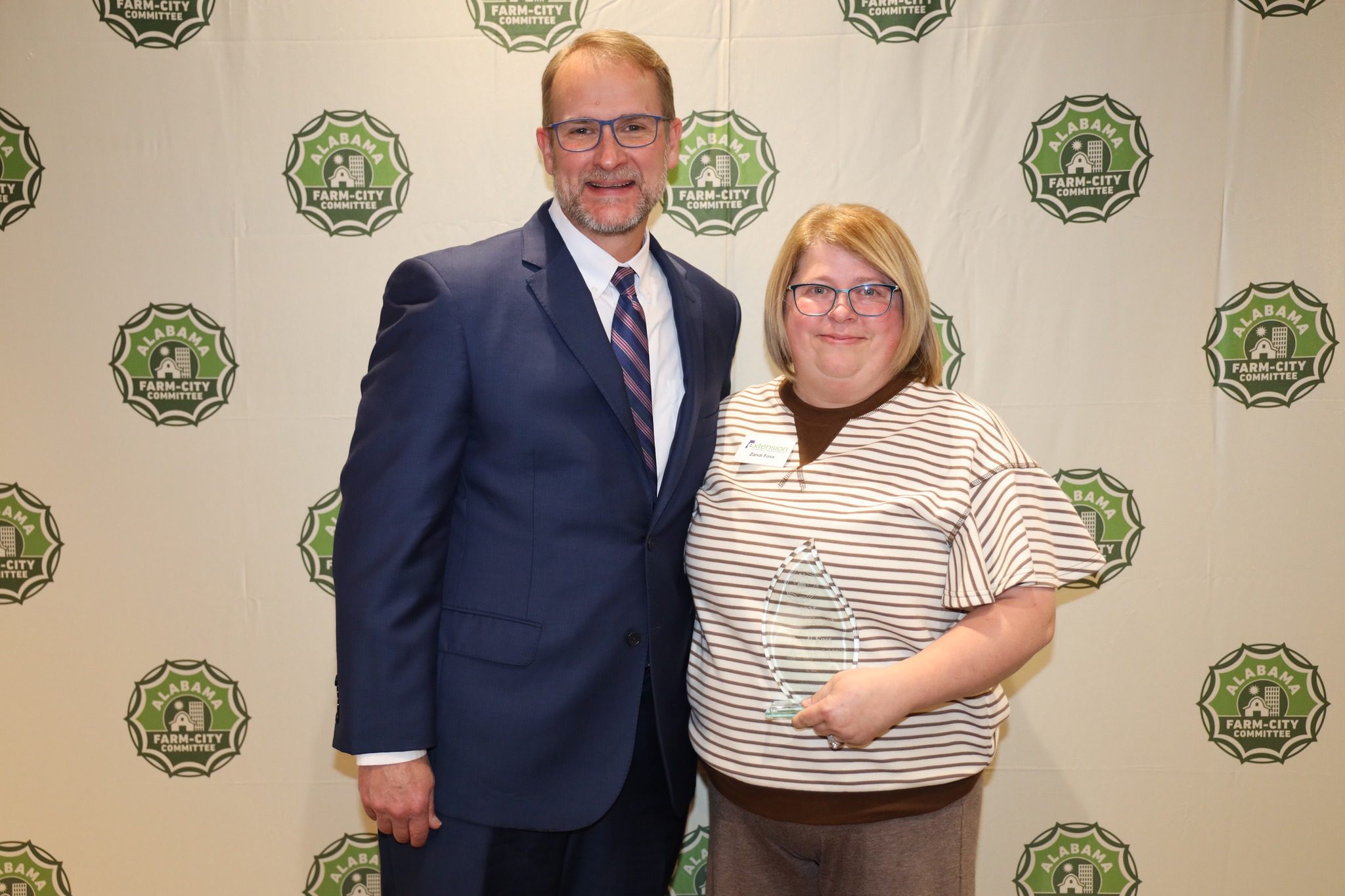Dale County's Zandi Foss, right, is pictured with Alabama Farm-City Chairman Jeff Helms.