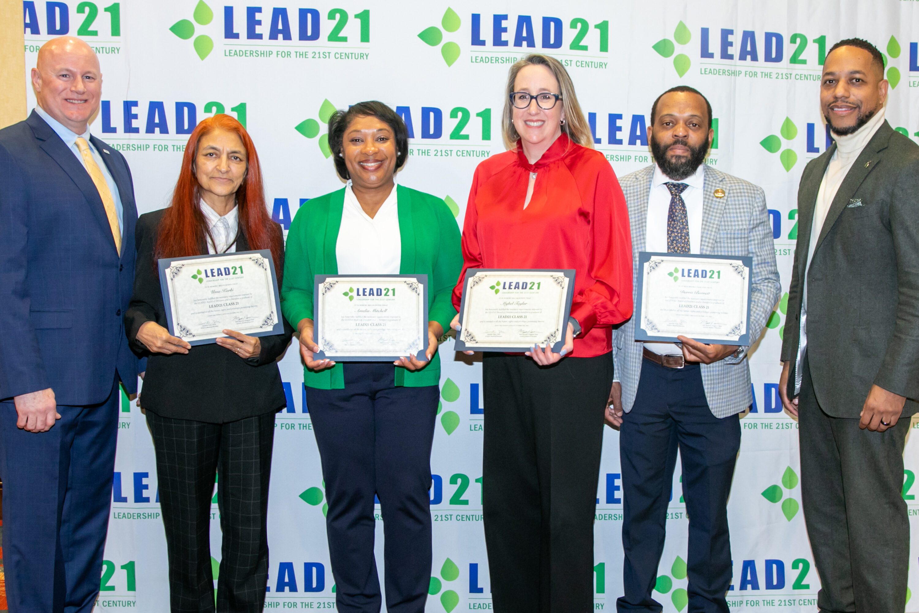 Amelia Mitchell, assistant director for field operations with Alabama Extension at Auburn University, recently graduated from the LEAD21 leadership development program. From left are LEAD21 At-Large Member Matt Hersom of Clemson University; Alabama's LEAD21 graduates Uma Karki of Tuskegee University, Mitchell, Mykel Taylor of Auburn University and Derris Burnett of Tuskegee University; and LEAD21 Board Chair Quentin Tyler of Michigan State University.