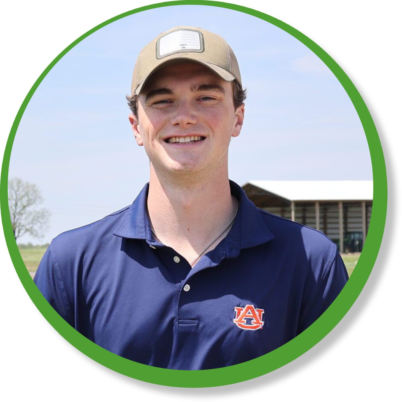 Duncan McSorley posing for a photo with a barn in the background.