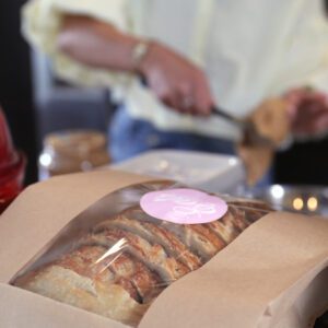 A bag of sliced sourdough bread with an Eats by Elizabeth sticker.