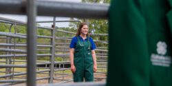 Kaleigh Backstrom in a cattle working pen.