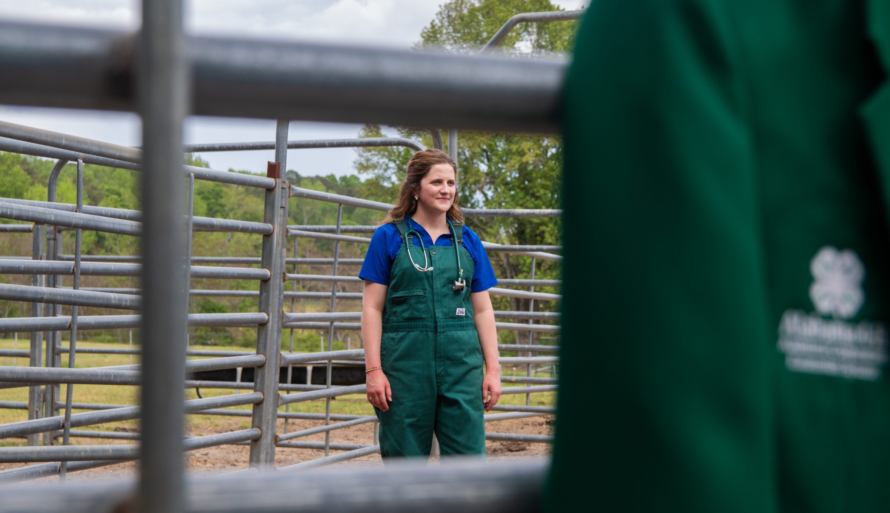 Kaleigh Backstrom in a cattle working pen.