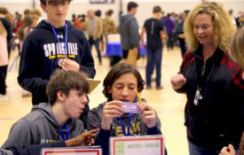St. Clair County students reacting to Life Happens card at the Your Money, Your Life program.