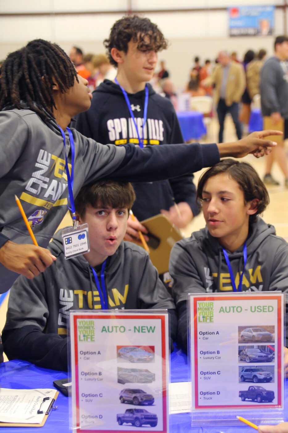 St. Clair County students reacting to Life Happens card at the Your Money, Your Life program.