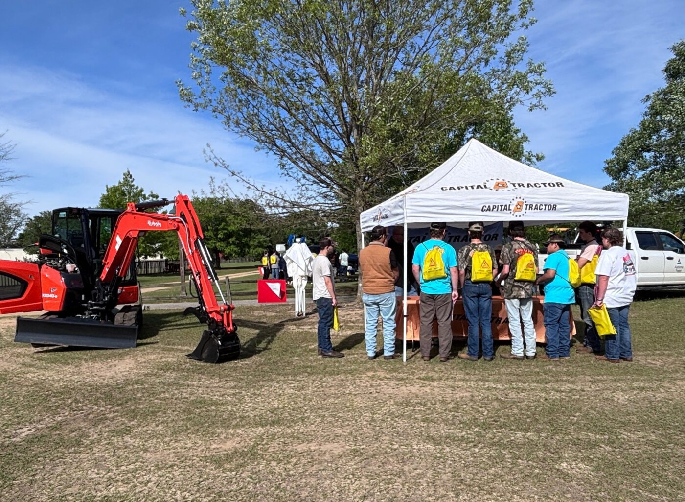 A group of students stands outside an exhibit at the Ag Career Expo.