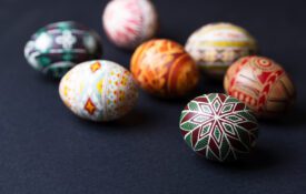 Pysanka Easter eggs on a black background.