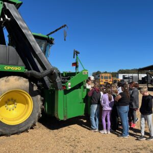 Figure 24. Fayette County 4-H’ers learning about modern cotton picking operations for their AgVenture field day