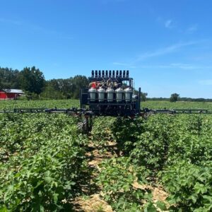 Figure 17. Spraying a field as part of an on-farm plant bug trial in central Alabama
