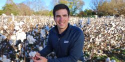 Scott Graham in a cotton field at harvest time.